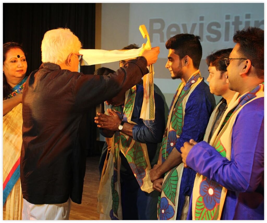Author receiving recognition during a literary award ceremony and book publishing event.