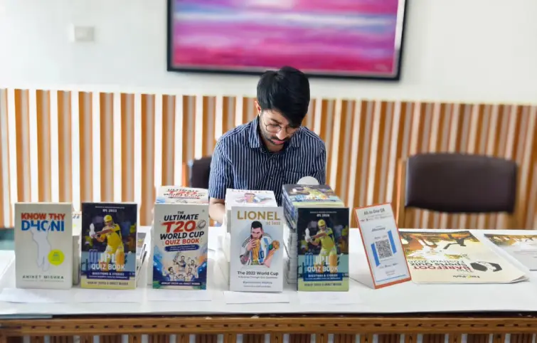 Blue Pencil sports quiz books displayed at Barefoot 2026
